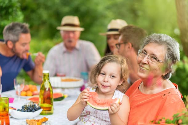 A family visiting their elderly family member