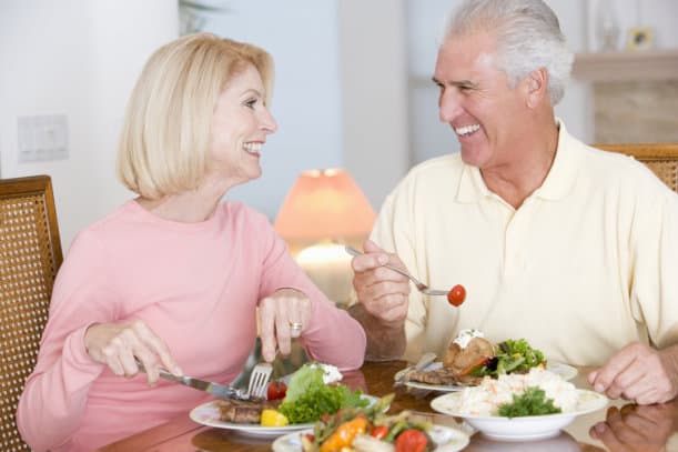 Two adults eating healthy food