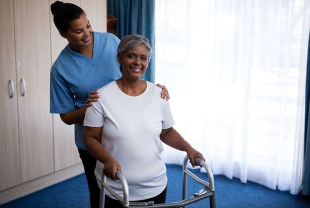 A senior citizen using a walking frame