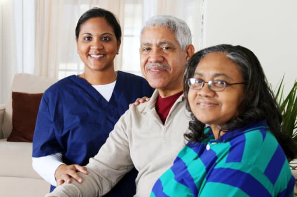 A caregiver with two senior citizens